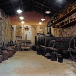 ancient cellar with barrels and ancient instruments